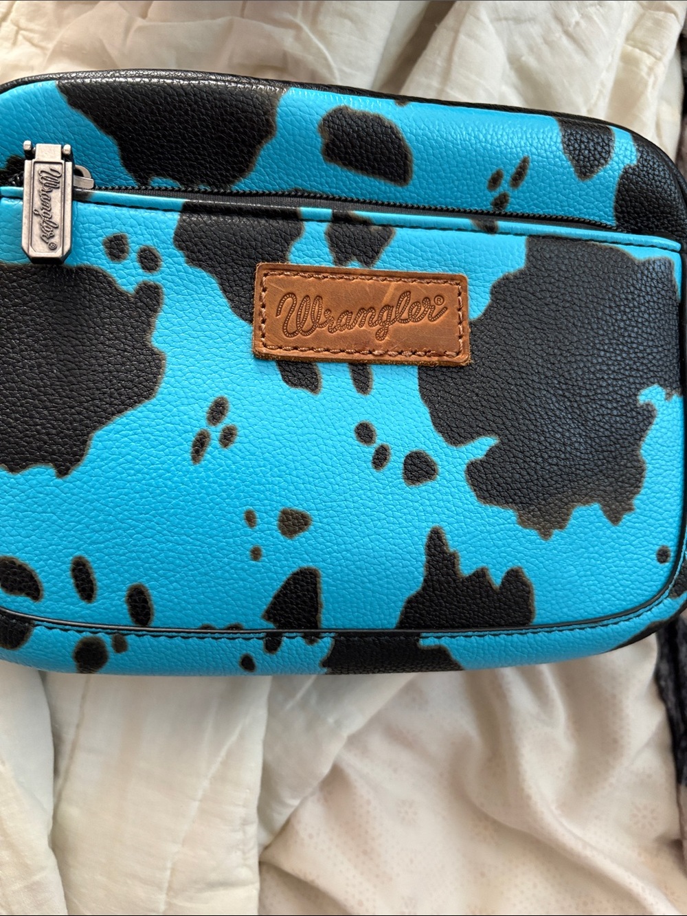 Wrangler Turquoise & Black Cowprint Crossbody with Tan Logo Patch